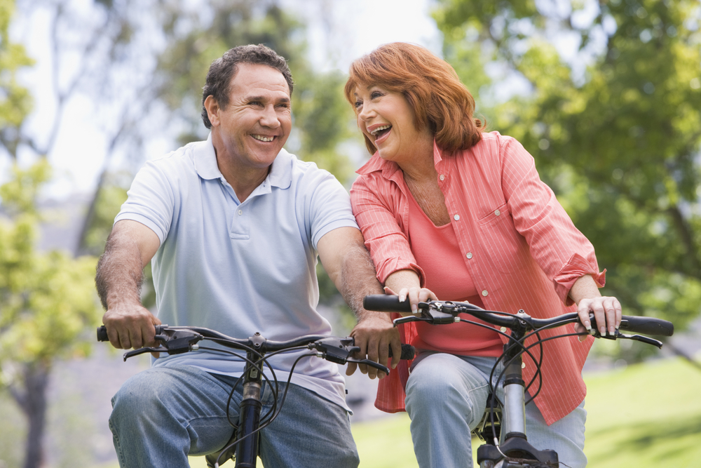 Senior couple riding bikes