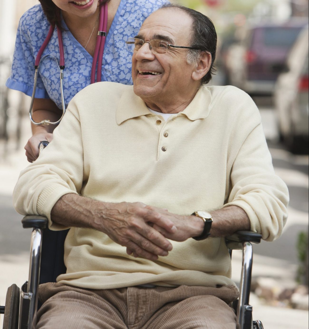 Senior and a nurse smiling